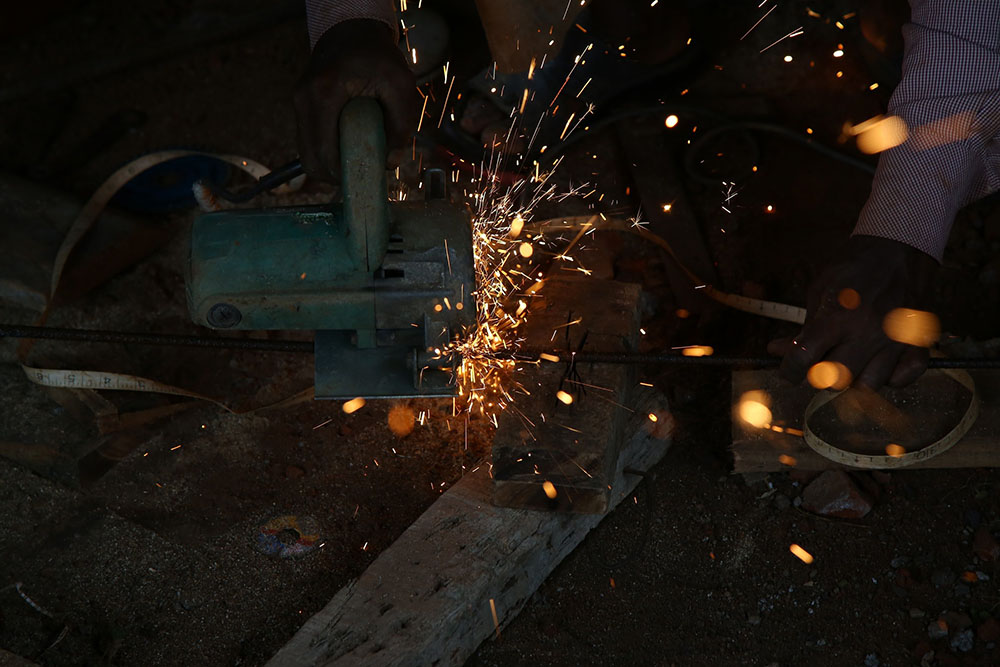 Man using a power tool in a shop