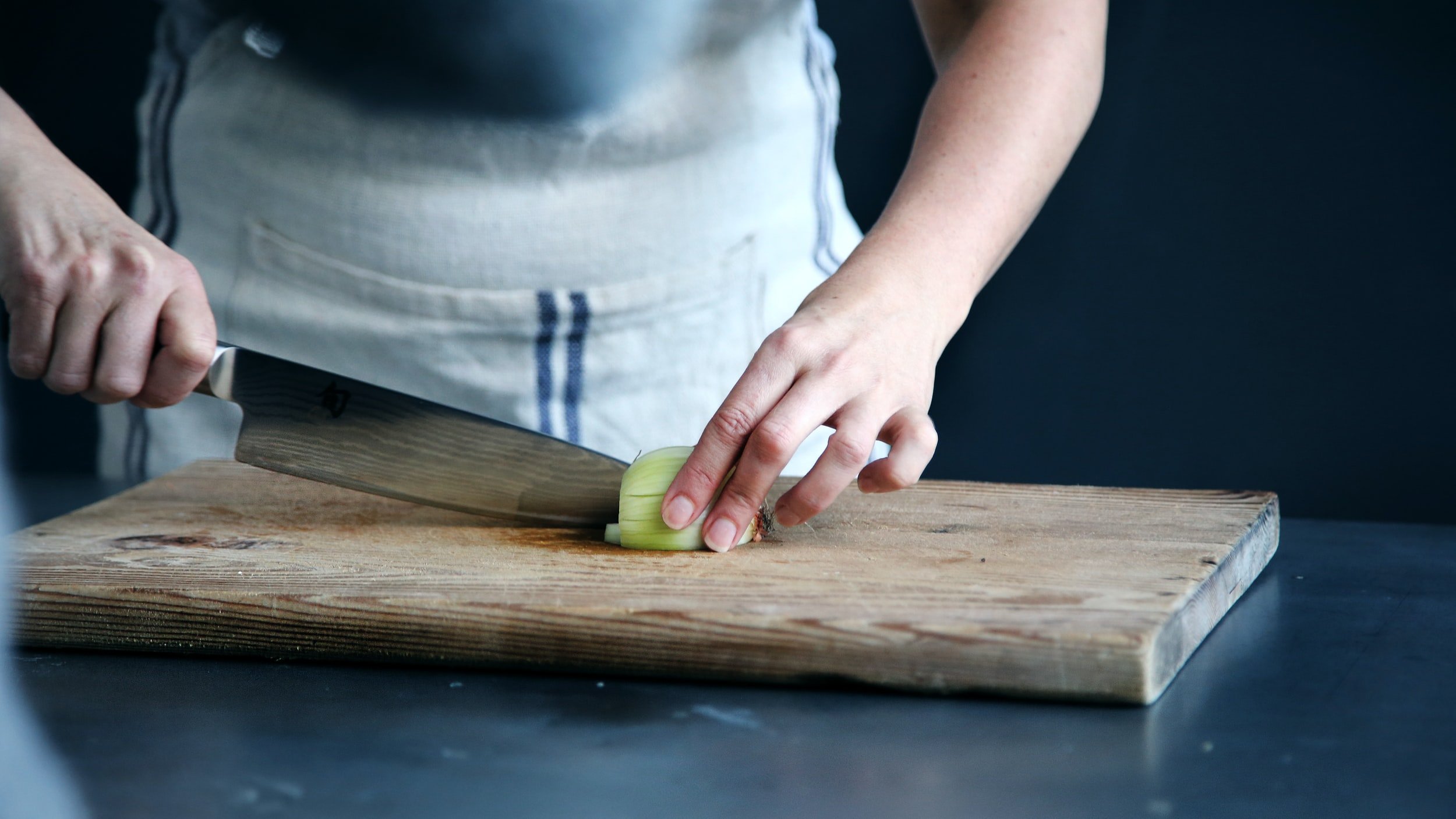 Man chopping an onion